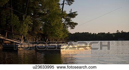 Pier in a lake, Lake of the Woods, Ontario, Canada View Large Photo Image Stock Photography - Pier in a lake, Lake of the Woods, Ontario, Canada. Fotosearch