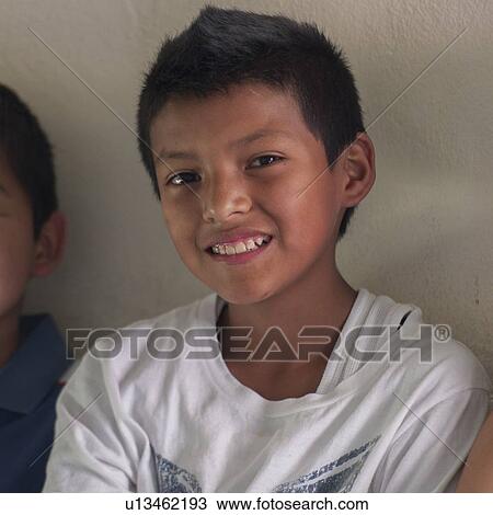 Stock Image - Portrait of a boy smiling, Colonia Bethania, Guatemala City, Guatemala. Fotosearch