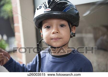 Portrait of a boy wearing a cycling helmet, Guatemala City, Guatemala View Large Photo Image Stock Photography - Portrait of a boy wearing a cycling helmet, Guatemala City, Guatemala. Fotosearch