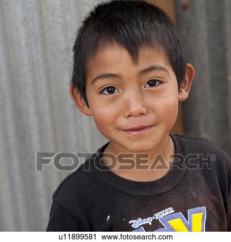 Stock Image - Portrait of a boy, Zona 3, Guatemala City, Guatemala. Fotosearch