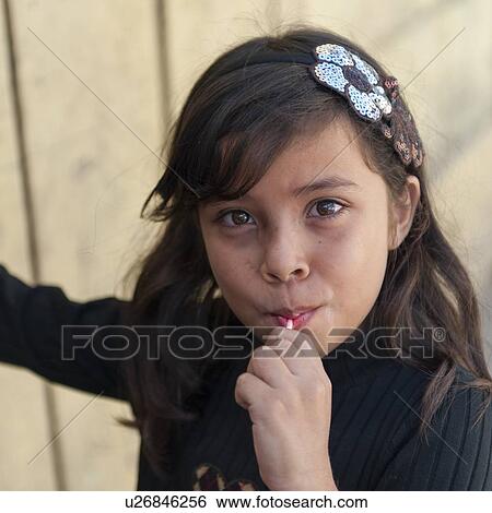 Portrait of a girl eating lollipop, Colonia Landivar, Guatemala City, Guatemala View Large Photo Image Stock Photograph - Portrait of a girl eating lollipop, Colonia Landivar, Guatemala City, Guatemala. Fotosearch