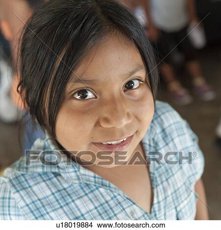 Picture - Portrait of a girl smiling, Colonia Bethania, Guatemala City, Guatemala. Fotosearch
