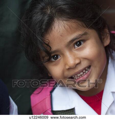 Stock Photo - Portrait of a girl smiling, Guatemala City, Guatemala. Fotosearch