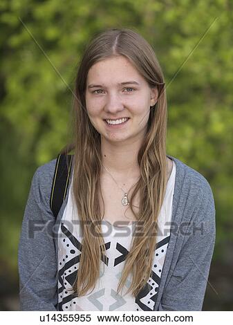 Stock Photography - Portrait of a teenage girl smiling, Lake of the Woods, Ontario, Canada. Fotosearch