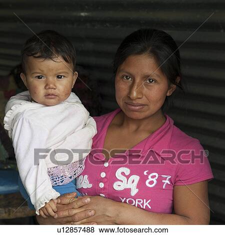 Portrait of a woman carrying her son, Colonia Landivar, Guatemala City, Guatemala View Large Photo Image Stock Photo - Portrait of a woman carrying her son, Colonia Landivar, Guatemala City, Guatemala. Fotosearch