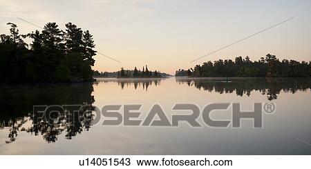 Reflection of trees in water, Lake of the Woods, Ontario, Canada View Large Photo Image Stock Image - Reflection of trees in water, Lake of the Woods, Ontario, Canada. Fotosearch