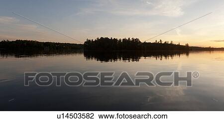 Reflection of trees in water, Lake of the Woods, Ontario, Canada View Large Photo Image Stock Image - Reflection of trees in water, Lake of the Woods, Ontario, Canada. Fotosearch