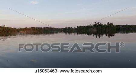 Reflection of trees in water, Lake of the Woods, Ontario, Canada View Large Photo Image Stock Image - Reflection of trees in water, Lake of the Woods, Ontario, Canada. Fotosearch