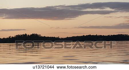 Silhouette of trees at the lakeside, Lake of the Woods, Ontario, Canada View Large Photo Image Picture - Silhouette of trees at the lakeside, Lake of the Woods, Ontario, Canada. Fotosearch