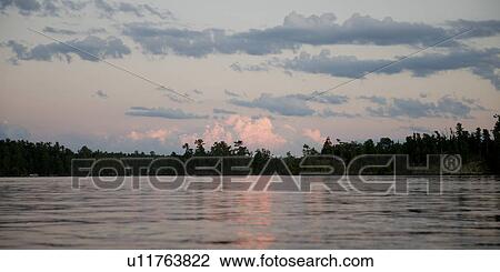 Silhouette of trees at the lakeside, Lake of the Woods, Ontario, Canada View Large Photo Image Stock Image - Silhouette of trees at the lakeside, Lake of the Woods, Ontario, Canada. Fotosearch