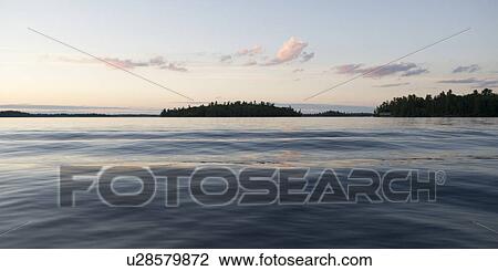 Silhouette of trees at the lakeside, Lake of the Woods, Ontario, Canada View Large Photo Image Stock Image - Silhouette of trees at the lakeside, Lake of the Woods, Ontario, Canada. Fotosearch