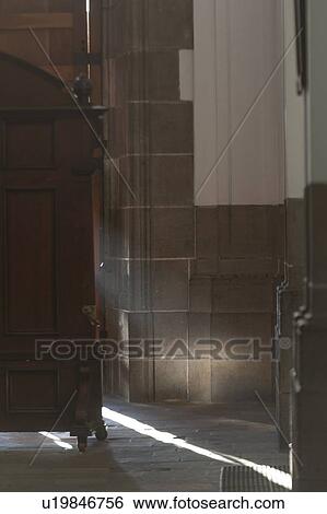 Stock Photograph - Sunlight falling from an open door, Guatemala City, Guatemala. Fotosearch