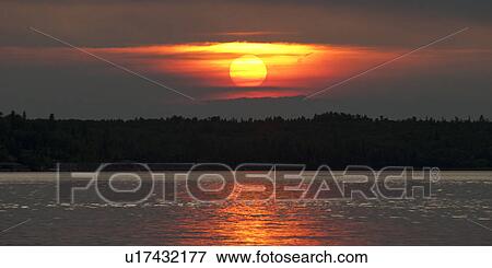 Sunset over a lake, Lake of the Woods, Ontario, Canada View Large Photo Image Stock Photo - Sunset over a lake, Lake of the Woods, Ontario, Canada. Fotosearch