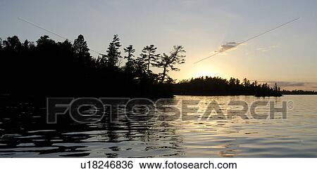 Sunset over a lake, Lake of the Woods, Ontario, Canada View Large Photo Image Stock Photograph - Sunset over a lake, Lake of the Woods, Ontario, Canada. Fotosearch