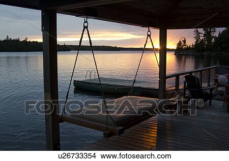 Swing at a dock, Lake of the Woods, Ontario, Canada View Large Photo Image Picture - Swing at a dock, Lake of the Woods, Ontario, Canada. Fotosearch