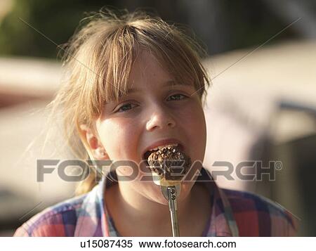 Teenage girl eating marshmallow, Lake of the Woods, Ontario, Canada View Large Photo Image Stock Photography - Teenage girl eating marshmallow, Lake of the Woods, Ontario, Canada. Fotosearch