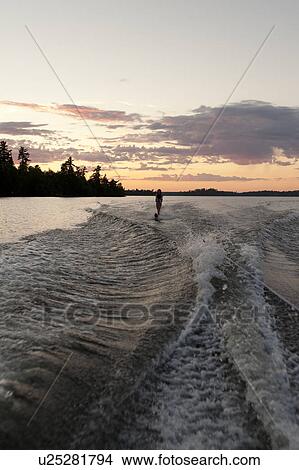 Teenage girl waterskiing in a lake, Lake of the Woods, Ontario, Canada View Large Photo Image Picture - Teenage girl waterskiing in a lake, Lake of the Woods, Ontario, Canada. Fotosearch