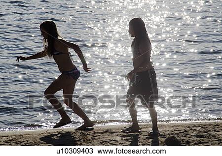 Two sisters running on the beach, Lake of the Woods, Ontario, Canada View Large Photo Image Stock Image - Two sisters running on the beach, Lake of the Woods, Ontario, Canada. Fotosearch