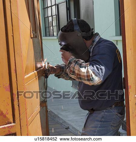 Welder welding a door, Colonia Landivar, Guatemala City, Guatemala View Large Photo Image Stock Image - Welder welding a door, Colonia Landivar, Guatemala City, Guatemala. Fotosearch