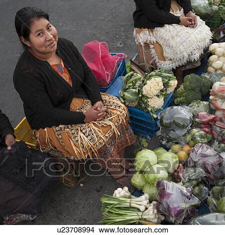 Picture - Woman selling vegetables in a street market, Zona 1, Guatemala City, Guatemala. Fotosearch