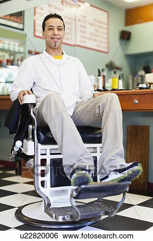 Barber sitting in chair in shop View Large Photo Image Stock Photograph - Barber sitting in chair in shop. Fotosearch