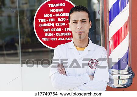 Barber standing outside shop View Large Photo Image Picture - Barber standing outside shop. Fotosearch
