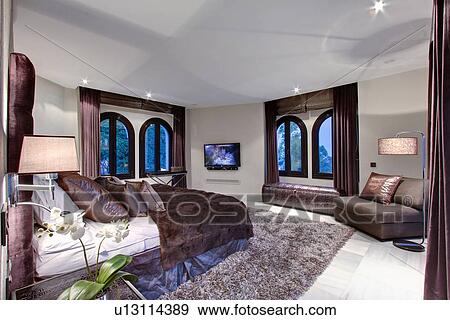 Bed and windows in modern bedroom View Large Photo Image Stock Photo - Bed and windows in modern bedroom. Fotosearch
