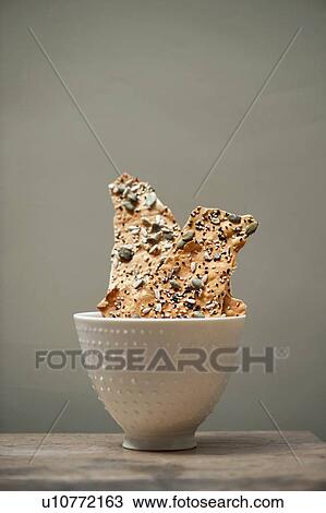Bowl of seeded flatbread View Large Photo Image Stock Image - Bowl of seeded flatbread. Fotosearch