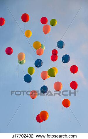 Bunch of balloons floating in sky View Large Photo Image Stock Image - Bunch of balloons floating in sky. Fotosearch