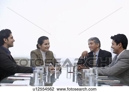 Business people talking in meeting View Large Photo Image Stock Image - Business people talking in meeting. Fotosearch