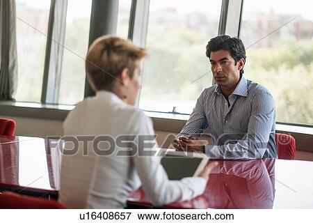 Stock Photo - Business people talking in meeting. Fotosearch