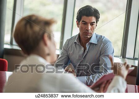 Business people talking in meeting View Large Photo Image Stock Photo - Business people talking in meeting. Fotosearch