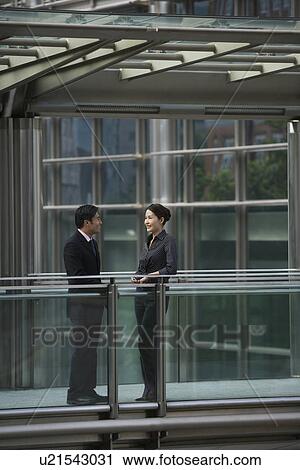 Business people talking in office View Large Photo Image Stock Image - Business people talking in office. Fotosearch