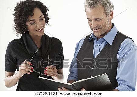 Stock Image - Business people talking in office. Fotosearch