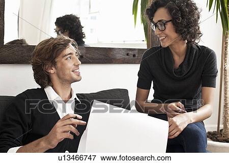 Business people talking on sofa View Large Photo Image Stock Photo - Business people talking on sofa. Fotosearch