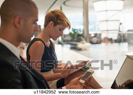 Business people using technology View Large Photo Image Stock Image - Business people using technology. Fotosearch