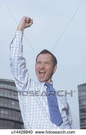 Businessman cheering outdoors View Large Photo Image Stock Image - Businessman cheering outdoors. Fotosearch