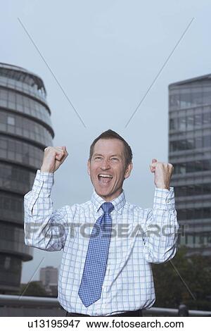 Businessman cheering outdoors View Large Photo Image Stock Photo - Businessman cheering outdoors. Fotosearch