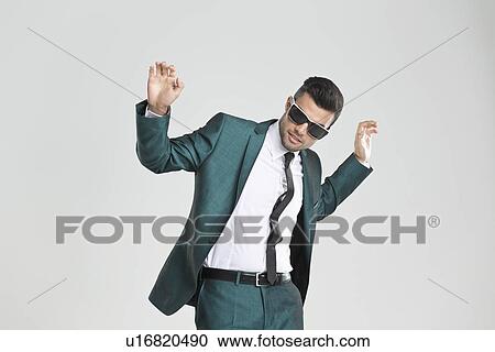 Businessman in sunglasses dancing View Large Photo Image Stock Image - Businessman in sunglasses dancing. Fotosearch