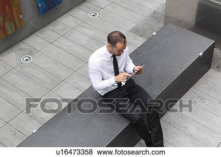 Businessman using tablet computer View Large Photo Image Stock Photo - Businessman using tablet computer. Fotosearch