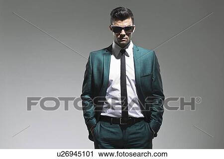 Businessman with hands in pockets View Large Photo Image Stock Image - Businessman with hands in pockets. Fotosearch