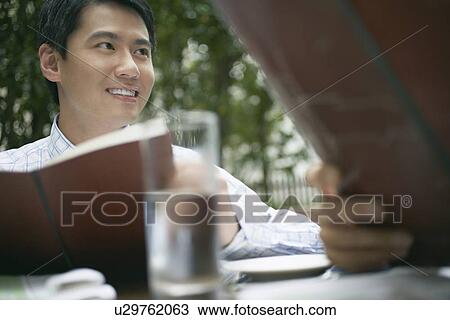 Businessmen having lunch together Stock Image | u29762063 | Fotosearch