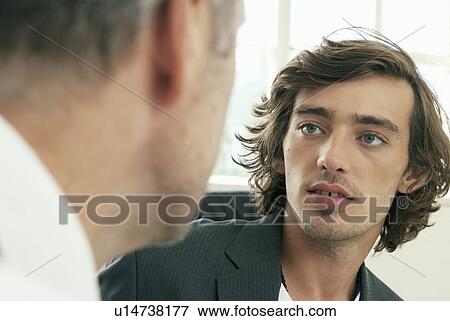 Businessmen talking in office View Large Photo Image Stock Photo - Businessmen talking in office. Fotosearch