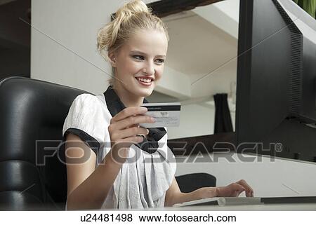 Businesswoman shopping online View Large Photo Image Stock Photo - Businesswoman shopping online. Fotosearch