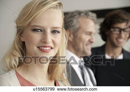 Stock Photo - Businesswoman smiling in office. Fotosearch