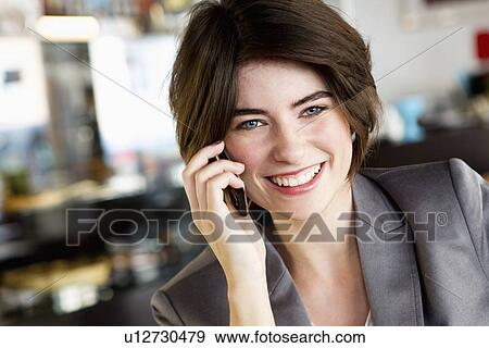 Businesswoman talking on cell phone View Large Photo Image Stock Photo - Businesswoman talking on cell phone. Fotosearch