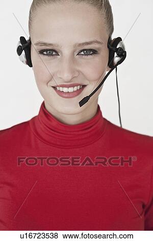 Businesswoman wearing headset View Large Photo Image Stock Photo - Businesswoman wearing headset. Fotosearch