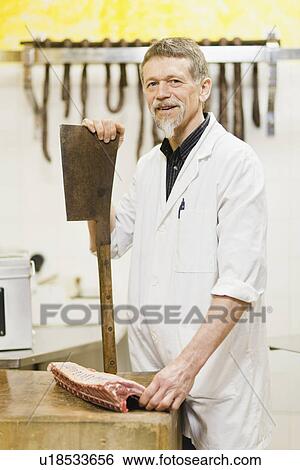 Butcher holding large knife and meat View Large Photo Image Stock Photograph - Butcher holding large knife and meat. Fotosearch