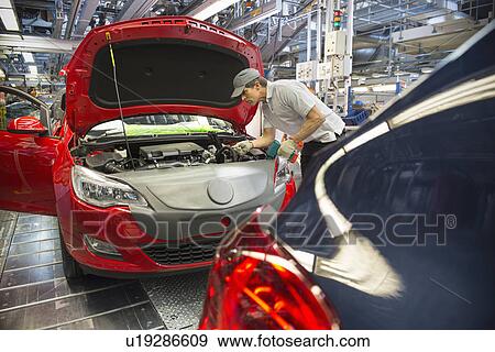 Car assembly worker in car factory View Large Photo Image Stock Photo - Car assembly worker in car factory. Fotosearch