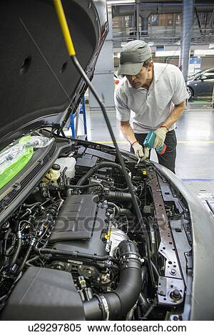 Car assembly worker in car factory View Large Photo Image Stock Photography - Car assembly worker in car factory. Fotosearch